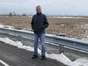 Ron Rusnak, of the Causeway Community Coalition, stands by the Long Point Causeway. The group is leading an effort to have a dedicated pathway installed adjacent to the causeway to provide another link between Long Point and Port Rowan. CONTRIBUTED PHOTO
