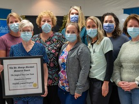 The surgical day care team at Norfolk General Hospital is the 2022 group recipient of the Dr. George Marshall Award. On hand for the presentation were, from left, Sara Block – RN; Shanya Jansema – RPN; Lindsey Propper – RN; Michelle Mason – Ward Clerk (holding the award); Charlene Neuman – RN (charge nurse); Lindsay James – RPN; Kim Mullins – NGH vice-president, clinical; Miriam Taylor – RPN; Sarah Webb – RN; Kathy Wardell – RN/Pre-op nurse; Sherry Chambers – RN clinical director. Absent from the photo are team members Carrie Martin – RPN and Samantha Riel – RPN. CONTRIBUTED