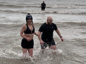 Haldimand-Norfolk MPP Bobbi Ann Brady, left, hurried from the cold waters of Lake Erie at Turkey Point Saturday, March 25 after plunging in to support Special Olympics.  SUSAN GAMBLE/Brantford Expositor
