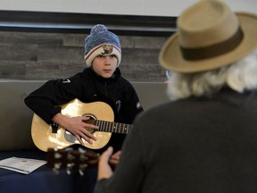 Xander Archer, a Grade 7 student at Lakewood Public School in Port Dover, focuses on a lesson during a guitar club session.  JP Antonacci, Local Journalism Initiative Reporter