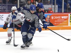 David Goyette, left, and teammate Kocha Delic, of the Sudbury Wolves, get tangled up during OHL action against the Oshawa Generals at the Sudbury Community Arena in Sudbury, Ont. on Friday March 3, 2023.