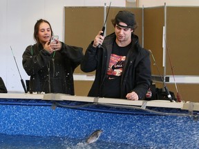 Halley Bertrim captures the moment when Matthew Korzeniecki snags a fish at the Sudbury Game and Fish Protective AssociationÕs fish pond at the Southridge Mall in Sudbury, Ont. on Thursday March 9, 2023. The fish pond is the main fundraiser for the organization, which uses the money for conservation projects and bursaries for Laurentian University biology students. The fish pond will be at the mall until March 19. John Lappa/Sudbury Star/Postmedia Network