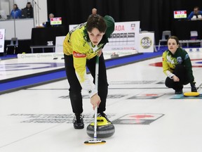 Tracy Fleury, of Northern Ontario, looks on as her teammate and brother, Jake Horgan, sweeps the rock during action at the 2023 Canadian Mixed Doubles Curling Championship at the Gerry McCrory Countryside Sports Complex in Sudbury, Ont. on Wednesday March 22, 2023. John Lappa/Sudbury Star/Postmedia Network