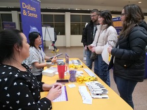 Incoming student Alyssa Sawatzky, from Ayr, and her parents Ann Marie and Curtis Sawatzky, meet Lisa Neziol, Aysha Chaudhry and Cherish Hwang from the Student Finance Group, Saturday afternoon during the Wilfrid Laurier University, Brantford Campus Open House. CHRIS ABBOTT