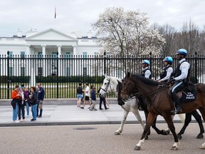 U.S. Park Police patrol Lafayette Square on horseback near the White House in Washington on Feb. 23. The capital has its charms, but sections of the city feel almost abandoned, even in the middle of the day.