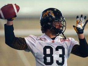 Andy Fantuz throws the ball in this 2014 file photo during Hamilton Tiger-Cats practice at Players Paradise Sports Complex in Stoney Creek, Ont.