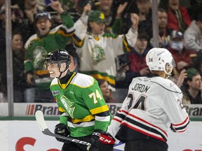 Jacob Julien of the Knights grins ear to ear after getting the first goal tucking it just inside the post behind Corbin Votary of the Attack in their first playoff game at Budweiser Gardens in London, on Friday March 31, 2023. 
Mike Hensen/The London Free Press/Postmedia Network