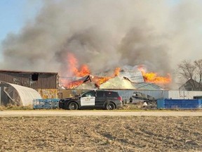 Fire crews are investigating a fire that fully engulfed a barn north of Goderich early Thursday. Provincial police say there were no reports of injuries and no animals were housed inside the barn (Huron OPP/Supplied)