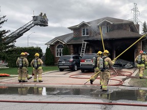 Kingston Fire and Rescue respond to a house fire at 495 Davis Dr. on April 19.