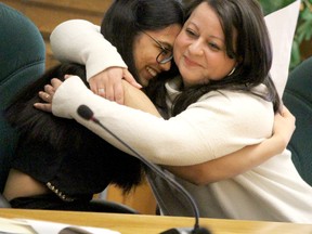 Mayesha Verma, a Grade 12 student at Superior Heights originally from India, hugs teacher Melissa Santa Maria at a meeting of Algoma District School Board trustees on Tuesday, April 25, 2023 in Sault Ste. Marie, Ont. (BRIAN KELLY/THE SAULT STAR/POSTMEDIA NETWORK)