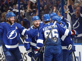 Tampa Bay Lightning winger Alex Killorn (17) celebrates with Steven Stamkos (91), Brayden Point (21) , Victor Hedman (77) and Nikita Kucherov (86) after scoring a goal against the Toronto Maple Leafs.