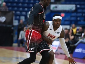 Braylon Rayson of the  Sudbury Five tries to get past a Windsor Express player during National Basketball League of Canada action at Sudbury Community Arena on Saturday night.