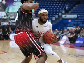 Dexter Williams Jr. of the  Sudbury Five tries to get past Adham Eleeda of the Windsor Express during National Basketball League of Canada action from the Sudbury Community Arena on Saturday night.