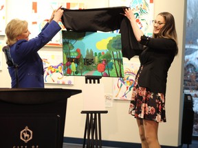 Fort Saskatchewan Mayor Gale Katchur and artist Trisha Sheppard unveil the winning artwork for Art in Public Places. Photos by James Bonnell.