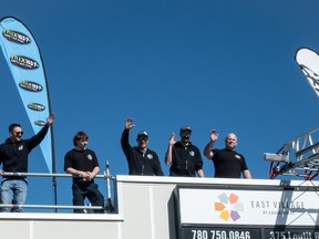 Members of the Fort McMurray Fire Department wave from the roof of the Eagle Ridge Tim Hortons for the annual Rooftop Campout fundraiser on Thursday, April 13, 2023. Vincent McDermott/Fort McMurray Today/Postmedia Network