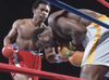 George Foreman demolishes Joe Frazier in January 1973 to win the heavyweight title.