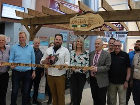Dignitaries and show workers joined in an official hockey stick
sawing to mark the official opening of the 50th annual Quinte Home and Lifestyles Show arranged by the Quinte Home Builders Association Friday. Left to right: Brian Garrard, Bay of Quinrte MP Ryan Williams, Rex Donovan with chain saw, show chair Ruth Estwick, Belleville Mayor Neil Ellis, Gord McCrady, Past President John Ross Parks (at rear), Gord McCrady and Warren Price. JACK EVANS PHOTO