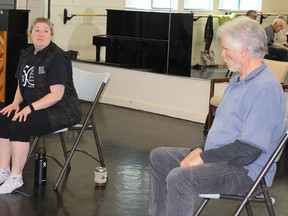 Kristina  McIntosh, a staffer at the Quinte Ballet School of Canada, leads movement exercises in the Dancing With Parkinsons Disease program at the school. At right is Joe Montgomery. JACK EVANS PHOTO