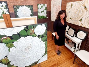 Chatham artist Penelope Duchesne displayed many of her floral paintings during the Spring Art Festival on Saturday at the Chatham Armoury, presented by Four Diamond Events.  PHOTOEllwood Shreve/Postmedia