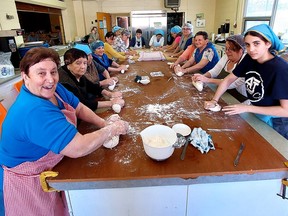 Several volunteers were busy making bread in preparation for the Festa Della Madonna Delle Grazie being held at St. Ursula Roman Catholic Church on Sunday, beginning with mass at 2:30 p.m. (Ellwood Shreve/Chatham Daily News)