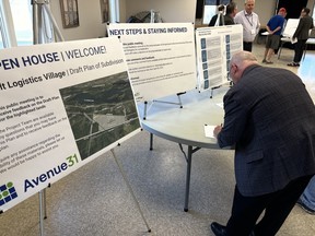 A visitor signs in at the drop-in format public meeting. Photo on Thursday, April 13, 2023, in Long Sault, Ont. Todd Hambleton/Cornwall Standard-Freeholder/Postmedia Network