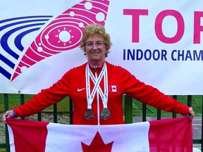 Laura Hessel dawns two medals and reps the Canada flag following the World Masters Indoor Track and Field Championships in Poland. (Supplied)