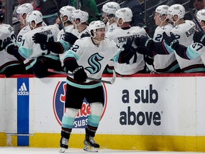 Tye Kartye (52) of the Seattle Kraken celebrates with his teammates after scoring against the Colorado Avalanche in the second period in Game 5 of the first round of the 2023 Stanley Cup playoffs on Wednesday night in Denver.