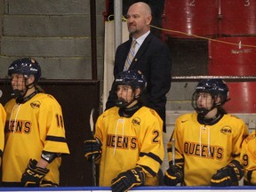Departing Queen's Gaels women's hockey coach Matt Holmberg behind the bench at the Kingston Memorial Centre on Saturday, Nov. 19, 2022.