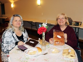 Connoisseurs Sharon Elmquist and Elizabeth Kerschbaum scored a table of baked goods at the Easter Tea and Bake Sale, held at Greencourt Community Hall Saturday morning and afternoon. The Greencourt Community Association's event is a springtime tradition in Green Court and area.