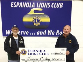 Photo by GRANT LEWIS
The Espanola Lions is always pleased to support junior curling in town. On hand from the curling club is JP Lamothe to receive a cheque for $3,400 from Lion Club member Randy Edwards.