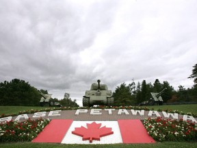 The union representing Defence Department employees says the government dropped the ball by not declaring staff at heating and wastewater plants on several military bases as essential workers. Clouds loom over the main gate at Canadian Forces Base Petawawa, Ont. Monday, Sept. 4, 2006.