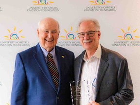 Ian Wilson, left, presents Richard Kizell with the Ian Wilson Award for Volunteerism at a ceremony in Kingston by the University Hospitals Kingston Foundation.