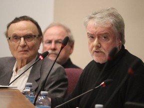 Sarnia Coun. David Boushy, left, looks on as Sarnia Mayor Mike Bradley speaks Wednesday at Lambton County council during a debate on the city's new official plan and efforts to open new residential development land new Bright's Grove.