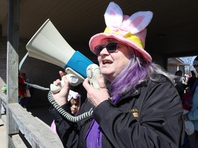 Cheryl Schleihauf, with the Lions club of Petrolia, makes an announcement before the start of Friday's Easter egg hunt in Petrolia's Greenwood Park.