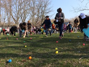 Youngsters run to collect eggs Saturday at Sarnia's Easter in the Park event at Canatara Park.