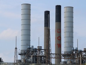 Dow's name can still be seen on a stack at its former chemical plant site in Sarnia. The company is taking the lead on a project this year to cap mercury-contaminated sediment in the St. Clair River.