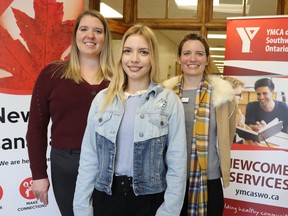 Yelyzaveta Baranovych, centre, who came to Canada from Ukraine last month, found work with help from the recently renewed Youth Employment and Skills Strategies program offered by the YMCA Learning and Career Center in Sarnia.  She's flanked by program co-ordinator Stephanie Bewski-Abrametz, left, and staffer Edith Kealy.  (Paul Morden/The Observer)