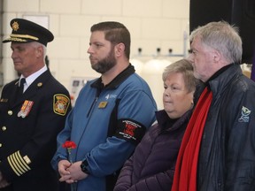 From left, Sarnia Fire Chief Bryan VanGaver, Nick Dochstader, president of the Sarnia and District Labor Council, Sandra Kinart, of Victims of Chemical Valley, and Sarnia Mayor Mike Bradley stand during Friday evening's National Day of Mourning ceremony held at Sarnia's Clifford Hansen Fire Station.  Paul Morden/The Observer