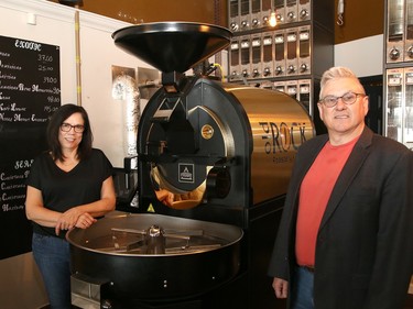 Carole and Luc Roy, owners of Old Rock Roastery on Minto Street in Sudbury, Ont., stand next to their state-of-the-art roaster. John Lappa/Sudbury Star/Postmedia Network