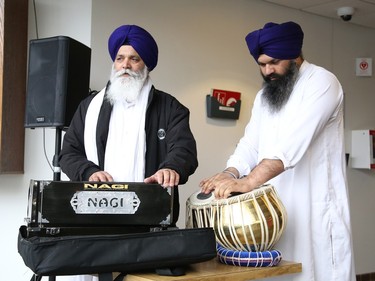 Bhai Piara Singh, left, and Bhai Sukhjinder Singh perform a prayer song at a ceremony marking Sikh Heritage Month at Tom Davies Square in Sudbury, Ont. on Monday April 3, 2023. The Nishan Sahib Sikh flag was raised during the ceremony. John Lappa/Sudbury Star/Postmedia Network