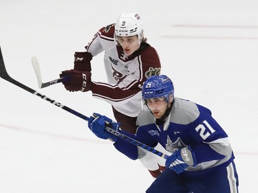 Brian Zanetti, left, of the Peterborough Petes, and Alex Pharand, of the Sudbury Wolves, battle for position during OHL playoff action at the Sudbury Community Arena in Sudbury, Ont. on Tuesday April 4, 2023. John Lappa/Sudbury Star/Postmedia Network