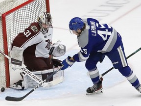 Ethan Larmand, right, of the Sudbury Wolves, looks for a rebound in front of goalie Michael Simpson, of the Peterborough Petes, during OHL playoff action at the Sudbury Community Arena in Sudbury, Ont. on Tuesday April 4, 2023. John Lappa/Sudbury Star/Postmedia Network