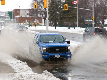 The weather conditions in Sudbury, Ont. on Wednesday April 5, 2023, created a number of large puddles on roads, including this puddle on Brady Street. Thursday will be mainly cloudy with a chance of flurries and a high of 0 degrees C. John Lappa/Sudbury Star/Postmedia Network