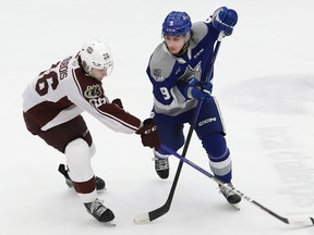 Chase Coughlan, right, of the Sudbury Wolves, and Jax Dubois, of the Peterborough Petes, battle for the puck during OHL playoff action at the Sudbury Community Arena in Sudbury, Ont. on Wednesday April 5, 2023. John Lappa/Sudbury Star/Postmedia Network