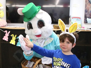 Zoran Kadar, 5, of Churchill Public School, visits with the Easter Bunny at the school in Sudbury, Ont. on Thursday April 6, 2023. The Easter Bunny and Ward 11 Councillor Bill Leduc visited a number of schools and senior residences, including Churchill, Pius XII Catholic Elementary School, Ecole St-Pierre, Westmount Retirement Residence, Extendicare Falconbridge and Finlandia Village. About 750 Easter treats were handed out to students and seniors on Thursday. The visits were made possible thanks to the Minnow Lake Community Action Network and Leduc. The Easter Bunny will visit Birkdale Village and Carmichael townhouses Saturday. John Lappa/Sudbury Star/Postmedia Network
