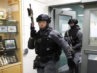 The Greater Sudbury Police tactical unit takes part in a shooting scenario at College Boreal in Sudbury, Ont. on Wednesday April 19, 2023. Members of the Greater Sudbury Police, paramedics and students from the college participated in the simulation. John Lappa/Sudbury Star/Postmedia Network