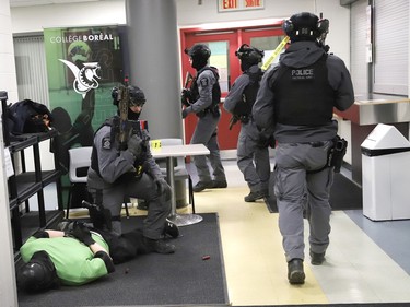 The Greater Sudbury Police tactical unit takes part in a shooting scenario at College Boreal in Sudbury, Ont. on Wednesday April 19, 2023. Members of the Greater Sudbury Police, paramedics and students from the college participated in the simulation. John Lappa/Sudbury Star/Postmedia Network