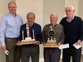 The Dante Club Bocce League's championship playoff winners, "Team Carlo," pose Saturday night at the club with their trophies. Pictured are, from left: Cliff Laming, Alfonso Colarossi, Captain Carlo Didone and Milton Workewich. The Championship game was held April 12, with Team Carlo winning two out of three series of four games played over three weeks. The Dante Club Bocce League was formed almost 50 years ago to maintain the traditional Italian past time.