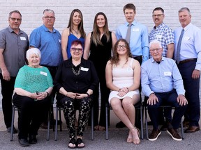 The honourees at the Dresden Sports Hall of Fame induction ceremony April 15 included, front row, left: Lynn Martin Memorial Award recipient Donna Babcock and inductees Linda Dunlop, Renae Nevills and Bobb Park. Back row: Mike Seed, Ken Ritchie, Justine (Brodie) Organ, Laura Brodie, athlete of the year Mitchell Pegg, Dennis Martin and Kevin Fox. Organ and Brodie represented their father, inductee Jay Brodie. Seed, Ritchie, Martin and Fox represented the four team inductees – the Dresden Jr. Kings' 1976-77 and '77-78 peewees and 1978-79 and '79-80 bantams – that won Ontario Minor Hockey Association championships. (Mark Malone)
