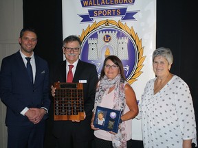 Barry Boley, who died in 2020, was inducted into the Wallaceburg Sports Hall of Fame in the coach/official category.  Shown here are head speaker Andy Fantuz;  hall of fame committee member Chris Phenix;  Teresa Boley, Barry's wife;  and committee member Marcia Simpson.  (Handout/Postmedia Network)